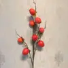 Fruta de simulación Caqui redondo Caqui plano ramas de caqui alta imitación fabricantes de artesanías decorativas europeas y americanas al por mayor espuma