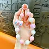 Cadena para teléfono con lazo y cuentas cuadradas transfronteriza, llavero, accesorio colgante de moda para bolso de niña, regalo pequeño, venta al por mayor
