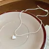 Popular en Japón y Corea, collar de perlas con corazón de gota de aceite de circón, cadena para clavícula en capas de alta gama de nicho, accesorio de moda y versátil