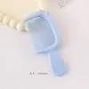 Nuevo y lindo mini peine de lazo con alto valor estético, peine de mango portátil para estudiantes, peine para peinar el cabello de niñas al por mayor