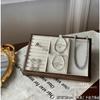 Bandeja pequeña de madera Sixi para joyería al por mayor, de nogal, para guardar anillos, collares y exhibidores de joyas.
