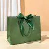 Saco de presente de arco saco de embalagem de roupas saco de cosméticos atacado saco de compras fita cor sacola logotipo