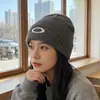 Bloguera de Corea del Sur con gorro de lana de punto con lazo otoño e invierno ins cabeza grande todo-fósforo moda protección para los oídos gorro para el frío para mujer
