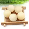 Fábrica directa de origen bola de cristal de piedra natural 25 mm jade Dongling pieza de mano bola decoración de escritorio matriz estelar