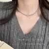 Collar de perlas de doble capa estilo retro francés para mujer, ligero, lujoso, de alta gama, con cadena para el cuello.