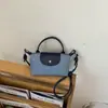 Bolso Cubo de Diseño Nicho Coreano con Parches de Lunares para Mujer 2026 Modelo Nuevo Exquisito Bolso de Hombro Cruzado para el Viaje Diario