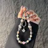 Elegante correa de cristal con cuentas para teléfono con colgante de girasol de circonita, cordón para teléfono, accesorio para muñeca y bolso, anti-pérdida