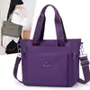 Bolsa tote de nylon de grande capacidade para mulheres, novo estilo 2026, bolsa de ombro leve e à prova d'água em tecido Oxford, adequada para o dia a dia, pode ser carregada na mão ou usada na transversal