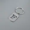 Venta Caliente de Productos Nuevos Transfronterizos 26 Letras Inglesas Huecas de Acero de Titanio Sin Decoloración Accesorios de Joyería Llavero 26 Letras