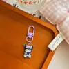 Llavero Morado Sanrio Colgante Pequeño Regalo de Graduación Regalo Pequeño para Pareja Llavero Colgante para Mochila Bolso Mochila Escolar