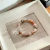 Pulsera Xirui Negra Dorada Natural de un Solo Círculo Regalo Personalizado Diseño de Nicho Joyería DIY Pulsera de Cristal Blanco para Mujer