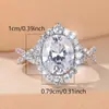 Anel de Noivado Feminino Twist Band com Coroa Dupla Cravejada de Diamantes, Pedra Principal Grande Oval Moissanite, Fonte de Suprimento