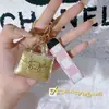 Chaveiro de Bolsa Dourada Ouro Puro 20mg Garante Riqueza, Garante Paz, Garante Beleza, Corrente para Celular Decoração de Carro