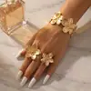Pulsera y anillo geométricos de flor abierta transfronterizos europeos y americanos, juego de dos piezas, juego de joyería exagerado y único ajustable para mujer