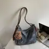 Colección de otoño 2026 transfronteriza: bolso de hombro elegante y de alta calidad, bolso tote retro, moderno y visualmente atractivo, gran capacidad, mochila casual