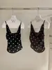 WGWE9409 Guangzhou Trece Líneas Ropa para Mujer Verano 2026 Nuevo Estilo Cuello Oscilante Lunares Cintura Ceñida Petite Camisola