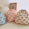Bolsa de tela de algodón con cordón y estampado de lazo bolsa de almacenamiento para viajes clasificación en casa bolsa de algodón al por mayor