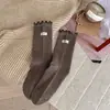 Calcetines de longitud media con volantes estilo coreano, calcetines de algodón holgados de color liso, nuevo producto de otoño, calcetines versátiles de encaje dulce para mujer