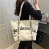 Bolsa tote casual y elegante para mujer, nuevo modelo 2025, única, simple, moderna, bolso de mano de nicho y bolsa de hombro para compras