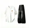 Conjunto de manga curta para homens, marca da moda ins de verão, roupas masculinas de corte solto, um conjunto estiloso de duas peças combinado com jeans de alta qualidade