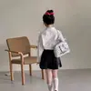 Conjunto Estilo Preppy para Niñas Falda Primavera y Otoño 2026 Nuevo Camisa Dulce con Lazo y Falda Plisada para Niños Mayores
