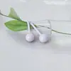Venta al por mayor de fábrica Pendientes de botón redondos de cerámica de 4 mm Material nuevo Zirconia Cerámica Pendientes de botón para piercing en la oreja