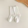 Calcetines de color liso hasta la mitad de la pantorrilla para niños, calcetines apilados de doble puntada para primavera y otoño, calcetines de algodón para niños y niñas, calcetines largos versátiles de color café estilo coreano