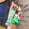 Chaveiro de corda de mão de panda rotativo criativo para carro, pingente de mochila escolar de estudante de desenho animado fofo feminino, pequeno presente para casal de celebridade online