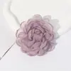 Atacado transfronteiriço coreano doce tridimensional Camélia corda de cabelo flor de tecido feita à mão puro desejo grampo de cabelo anel de cabelo cor sólida