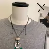 Collar Largo con Colgante de Agujero de Viento Escarchado para Mujer Nuevo Estilo Chino Diseño de Lujo Ligero Cadena de Suéter Deslizante de Gama Alta de Nicho