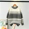 Suéter al por mayor suéter infantil mediano y grande para niños 2026 otoño e invierno nuevo estilo engrosado cálido suéter de punto suéter de lana para niños