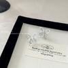 Aguja S925 Aretes Coreanos Huecos de Lazo Zircón Super Brillante Nicho Elegante Combinan con Todo Diseño de Alta Gama