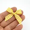 Accesorios de moño pequeño a cuadros de colores de caramelo de 1 cm para ropa, bolsos, cajas de regalo, decoraciones de piruletas, suministros de cinta DIY - directo de la fábrica fuente