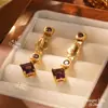 Estilo de corte europeo y americano oro ruso nicho nuevos aretes medievales borla perla diseño ojo de tigre aretes de alta gama