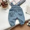 Conjunto de Duas Peças Estilo Coreano para Meninas Moda Outono 2026 Versátil Floral Camisa Boneca Macacão Jeans Conjunto Tendência