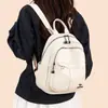Mochila feminina transfronteiriça nova de couro PU macio, moderna e minimalista, adequada para o trabalho, uso casual e viagens; uma bolsa pequena versátil para mulheres