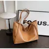 Bolsa de ombro para comércio exterior transfronteiriço para mulheres, novo modelo 2026, cor sólida, bolsa tote de grande capacidade, bolsa de trabalho estilosa e texturizada