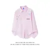 Camisa juvenil azul con bordado floral tridimensional para hombres y mujeres, camisa casual holgada de manga larga para pareja, estilo dopamina de otoño