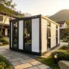 Casa contenedor de bloques de color con puerta de entrada de cristal grande, adecuada para alojamientos en zonas escénicas, campamentos al aire libre y vida móvil