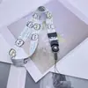 Cuerda para colgar en el cuello de teléfono móvil de dibujos animados 2 en 1 de 25 mm con colgante Adornos colgantes Funda de teléfono móvil con cuerda para colgar en el cuello Cuerda larga de marca de fábrica
