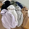 Pedido de fábrica para chaqueta cálida con capucha gruesa de imitación de lana de cordero para parejas de hombres y mujeres, top con capucha moderno y versátil