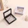 Stock listo Caja de suspensión de película de PE al por mayor Caja de joyería Caja de almacenamiento para collares, pulseras y anillos Caja de joyería transparente