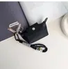 Bolsa Mini Compacta para Empanadas Bolso de Labial, Auriculares y Llaves de Nicho Bolsa de Almacenamiento Portátil Decorativa Simple