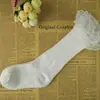 Versión coreana de las nuevas medias de encaje de color liso para niños Primavera y Otoño Invierno algodón peinado para bebé Calcetines Altos Calcetines al por mayor