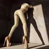 Calças de couro PU transfronteiriças estilo ins feminino leggings sexy femininas calças de couro brilhantes europeias e americanas justas ao quadril casa noturna PK07