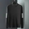 Camiseta casual versátil de manga larga para hombre para otoño, cuello redondo, color liso moderno, cómoda, transpirable y de corte holgado.