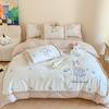 Almohada caricatura algodón 120S lijado juego de cuatro piezas bordado de conejo lindo edredón grueso de otoño e invierno ropa de cama