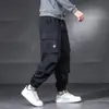Pantalones Cargo con Bolsillos de Múltiples Solapas Estilo Japonés Marca de Moda Talla Grande Pierna Ancha con Cordón Primavera y Otoño Soldadura Trabajo al Aire Libre Pantalones Casuales