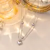Collar Transfronterizo Europeo y Americano Nuevo de Doble Capa con Corazón de Acero de Titanio para Mujer, Moderno y Versátil, Cadena de Clavícula de Gama Alta que No se Desvanece