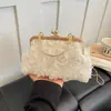 Bolsa de noite feminina transfronteiriça, bolsa concha com fecho floral, nova bolsa de mão outono 2026, bolsa de ombro com corrente, bolsa de axila
